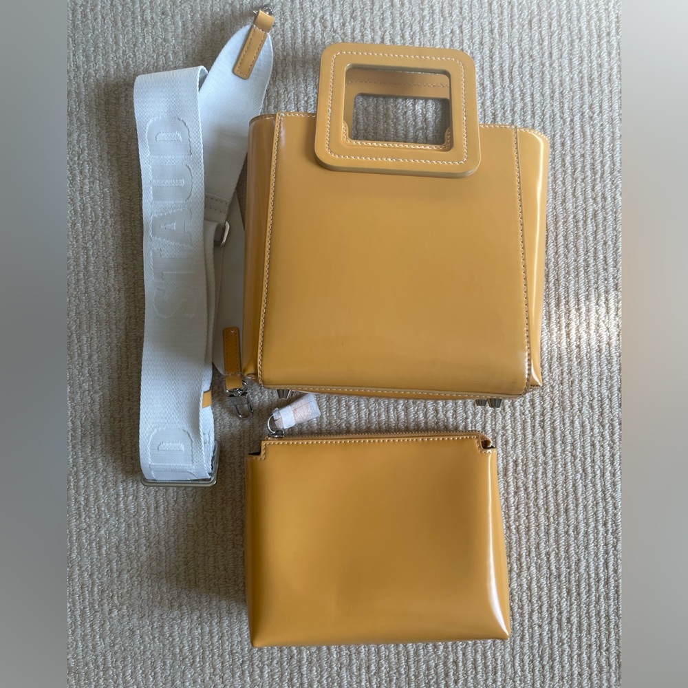 STAUD mini Shirley in Mango with white fabric strap